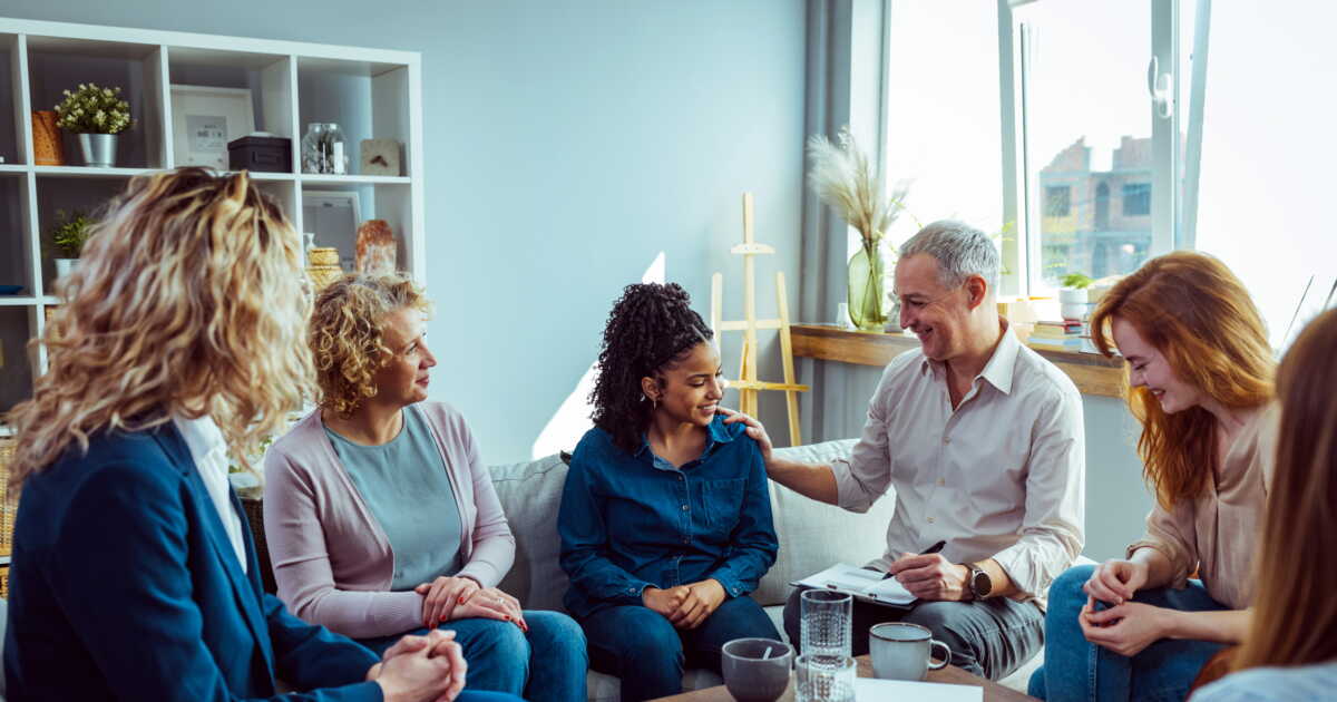 Support group patients comforting at therapy session